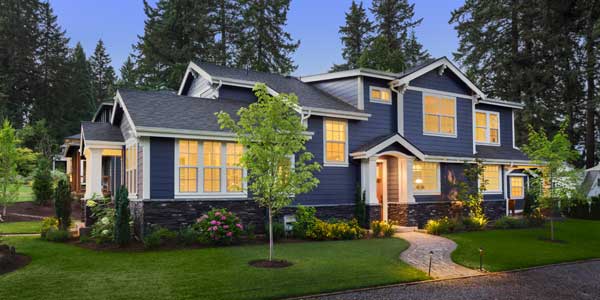 raq_house-img Photo of Blue House with Newly Planted Tree in Front Yard
